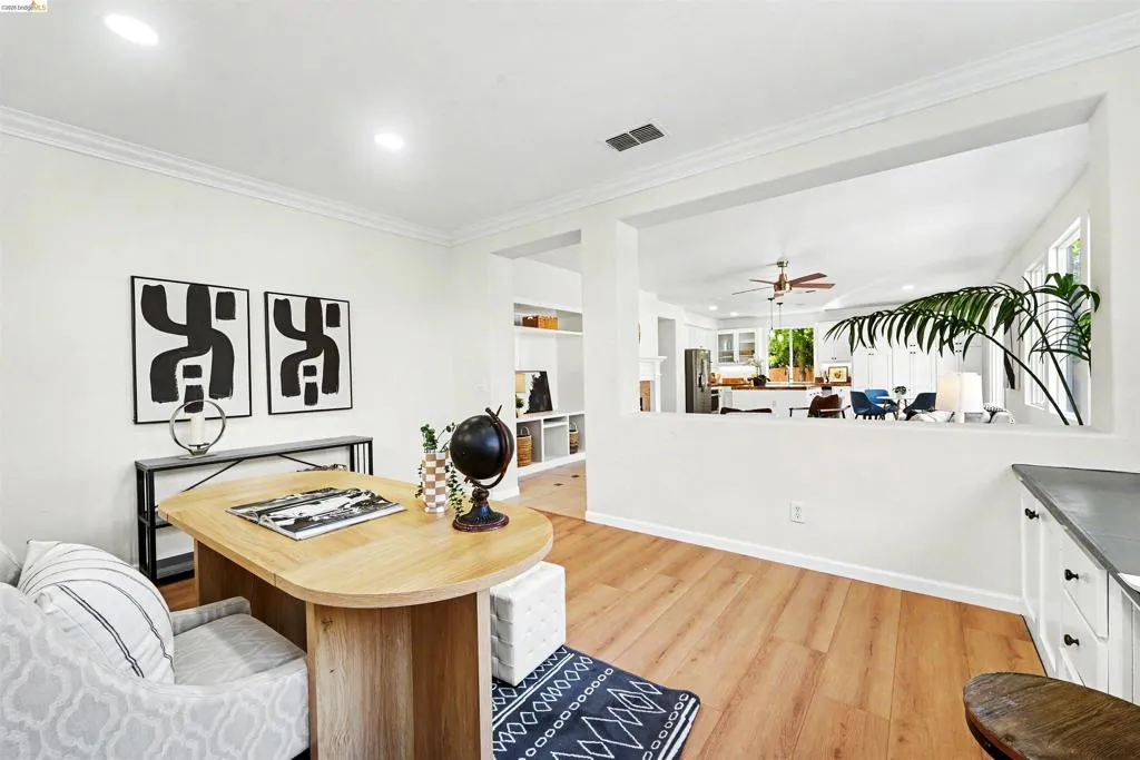 Bright interior space featuring wood-finish flooring, white walls, and recessed lighting