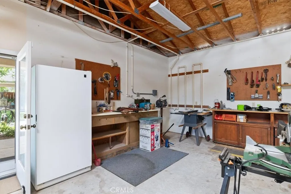 Built in work bench and storage areas. Freezer included.