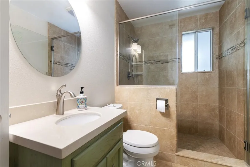 Main bathroom with step in shower.