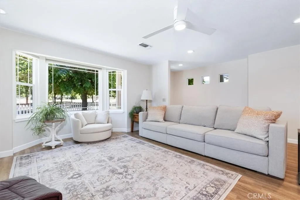 Living room area with front yard views.