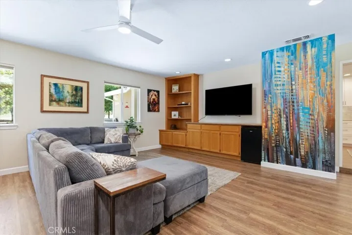 Lots of light and storage in great room with color pop!