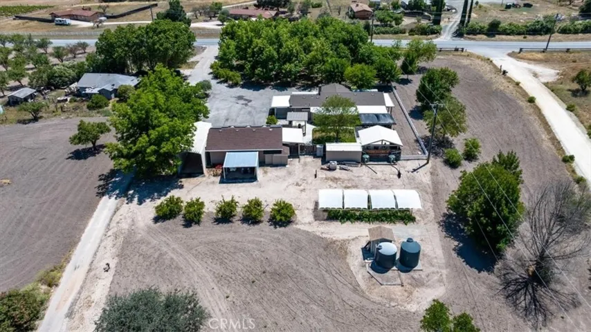 Aerial view, 2 wells, orchard, solar and shop!