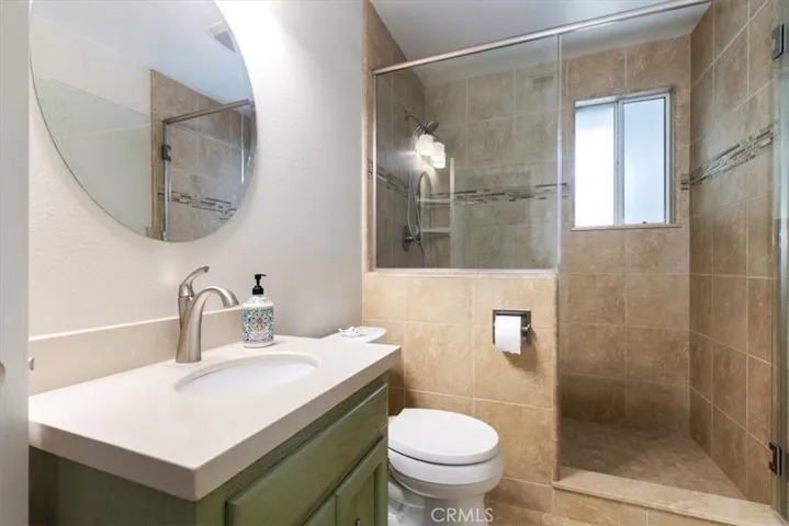 Main bathroom with step in shower.