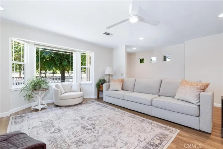 Living room area with front yard views.