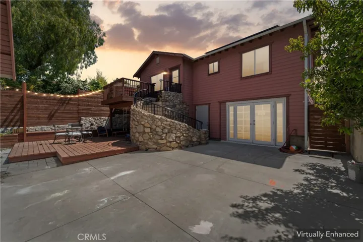 Looking at the beautiful stone surround staircase and double door entry to walk-out basement
