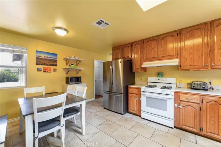 Spacious kitchen featuring a dedicated dining area.