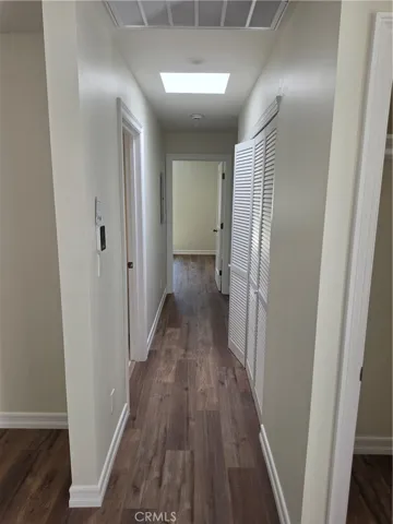 Hallway to bedrooms.  Laundry con the right.