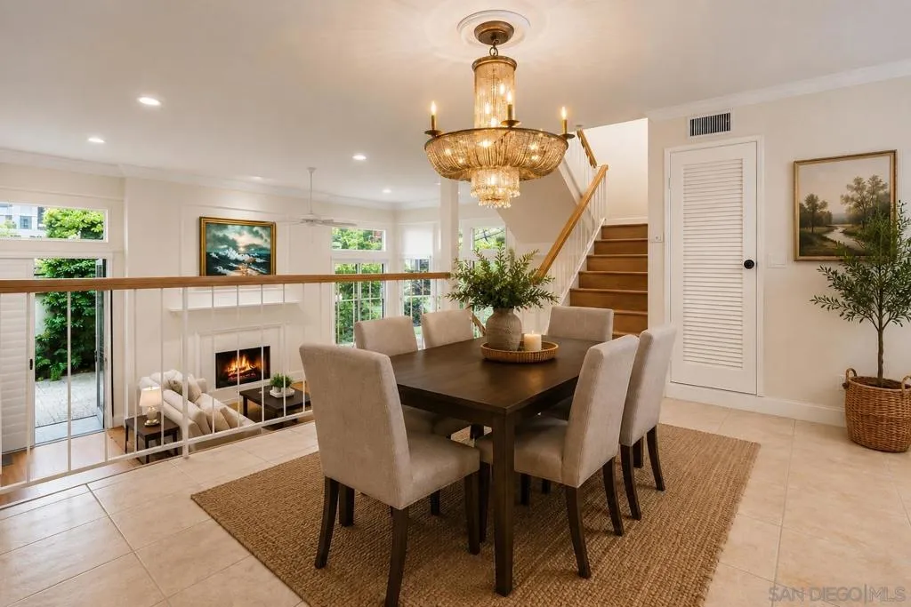 Open floor plan Dining Room overlooking Living Room and Open Kitchen. Virtually Staged.
