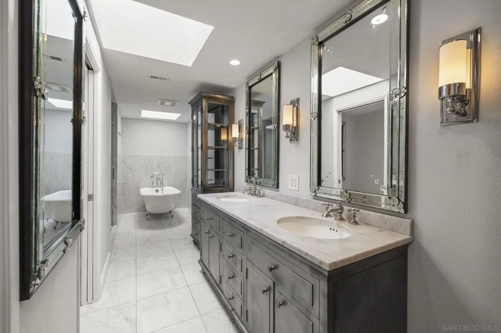 Fully Updated Luxury Spa Primary Bathroom with a Separate Closet, Water Closet including a Bidet, Heated Towel Rack, Footed Tub, Spa Shower and two Sky Lights, Offering Great Natural Lighting.