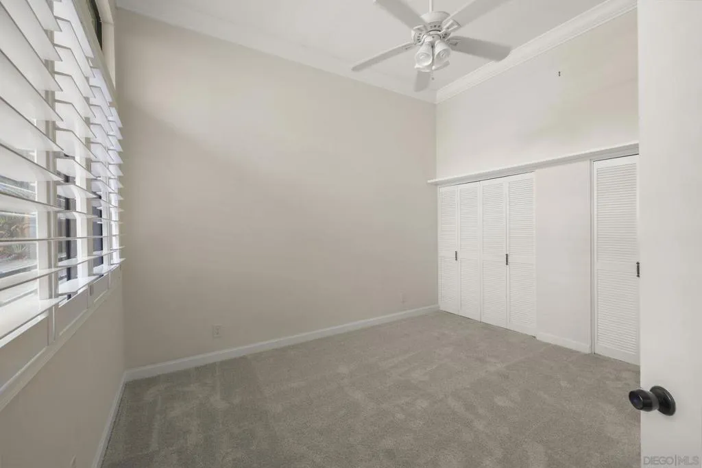 1st Floor Guest Bedroom with High Ceilings, Bathroom Ensuite and Custom Curated Plantation Shutters.
