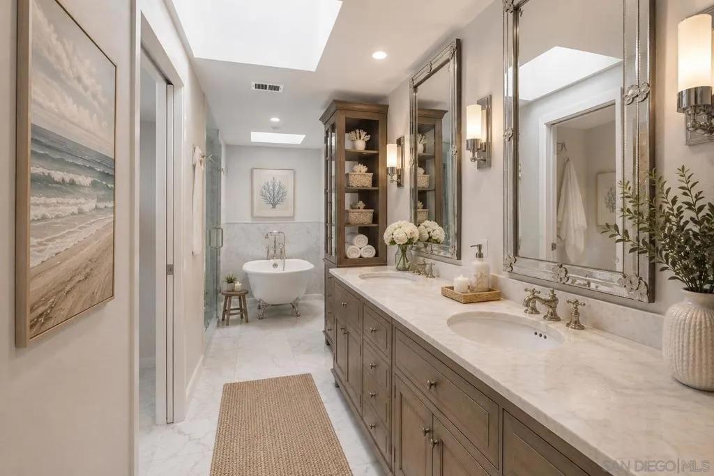 Fully Updated Luxury Spa Primary Bathroom with a Separate Closet, Water Closet including a Bidet, Heated Towel Rack, Footed Tub, Spa Shower and two Sky Lights, Offering Great Natural Lighting. Virtually Staged.