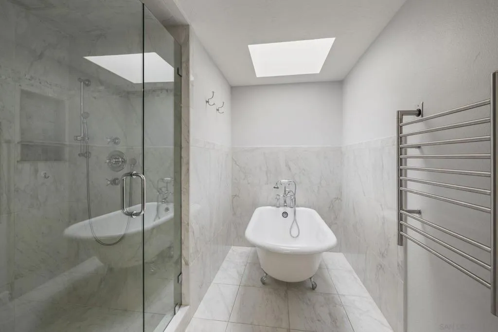 Fully Updated Luxury Spa Primary Bathroom with a Separate Closet, Water Closet including a Bidet, Heated Towel Rack, Footed Tub, Spa Shower and two Sky Lights, Offering Great Natural Lighting.
