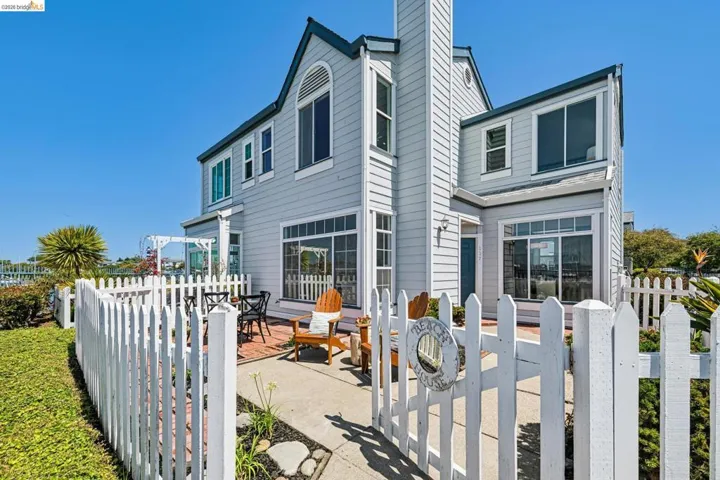 Light gray siding exterior with multiple large windows