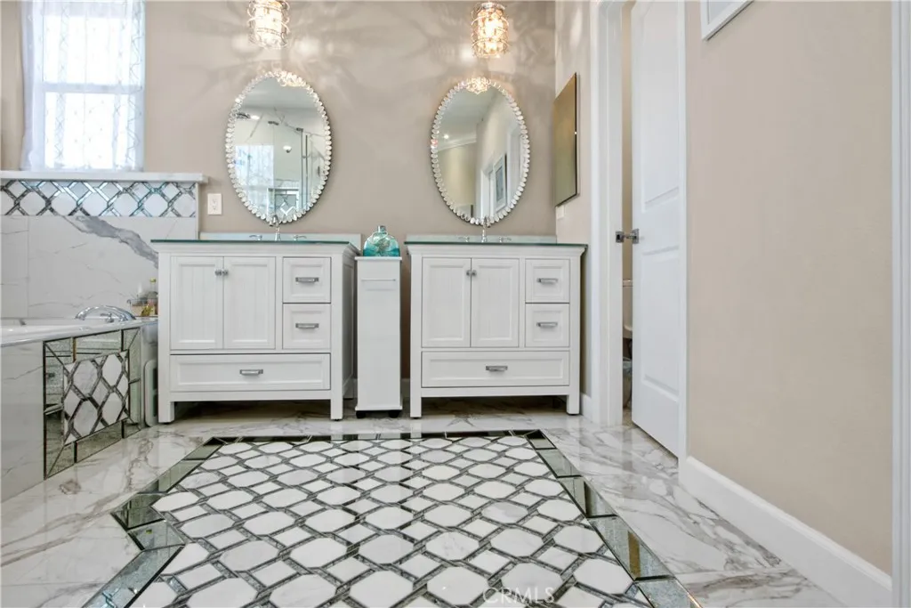 Mirror mosaic and carrara porcelain tiles!