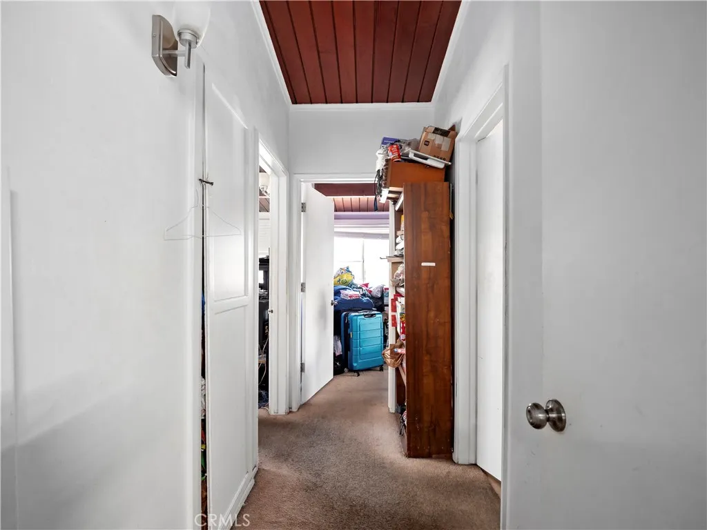 Hallway to bedrooms #1 & #2 and Primary Full Bathroom