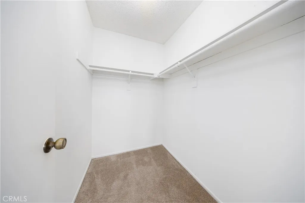 Primary bedroom walk-in closet