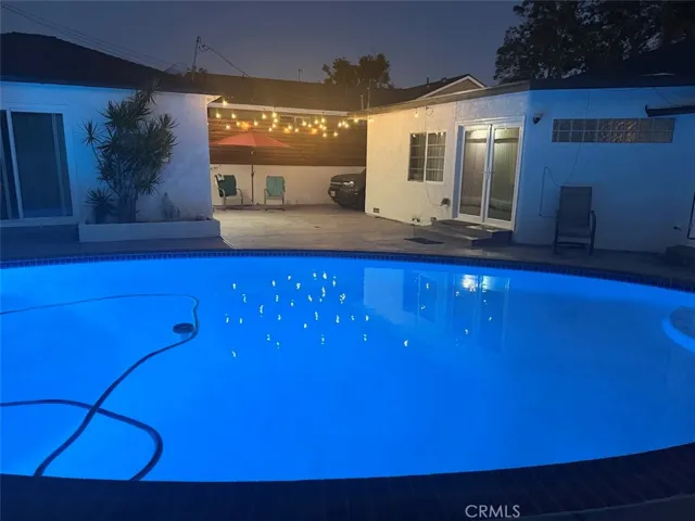 Pool at night, light changes different colors