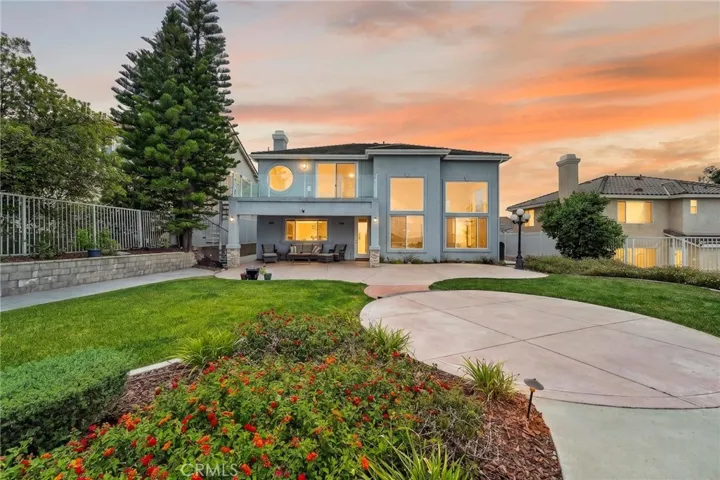 Back of home with balcony 16318 sun summit drive, riverside, california 92503(AI Twilight Edit)