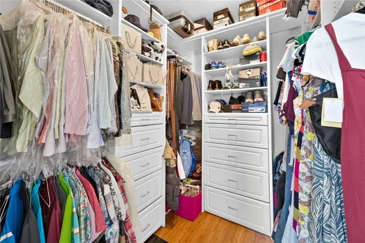 Primary bedroom walk in closet with organizers 16318 sun summit drive, riverside, california 92503