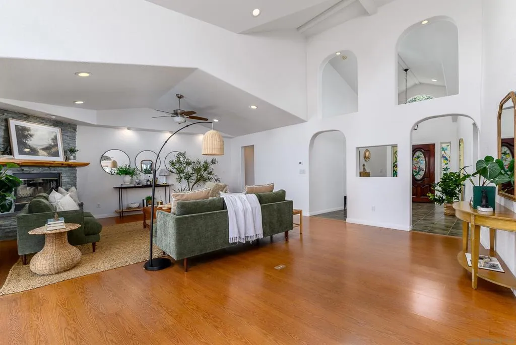 Living Room with Wood Burning Fireplace and access to  large deck