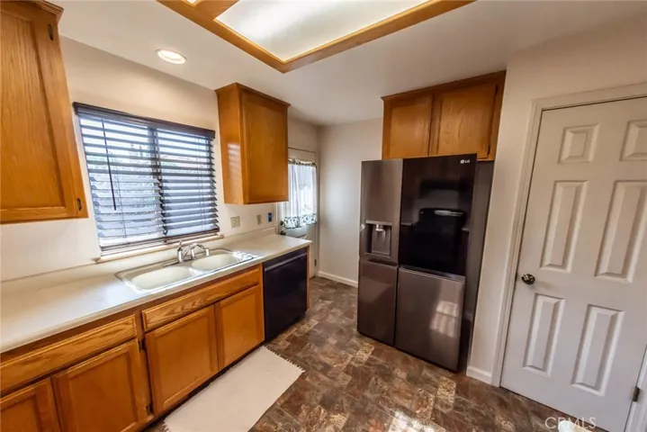 Pantry storage to the right of the refrigerator