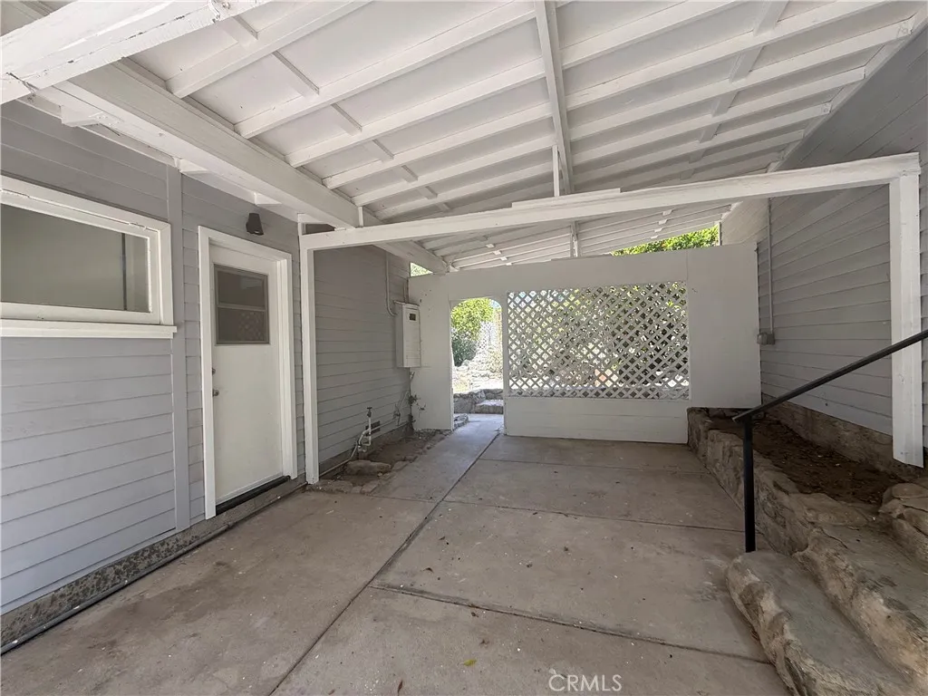 Covered Patio between the House and Garage.