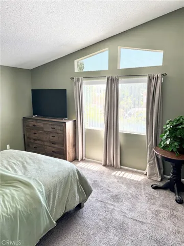 Primary Bedroom with high ceiling and all the natural lighting in this space!