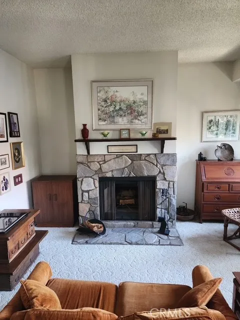 Stone fireplace in Primary Suite