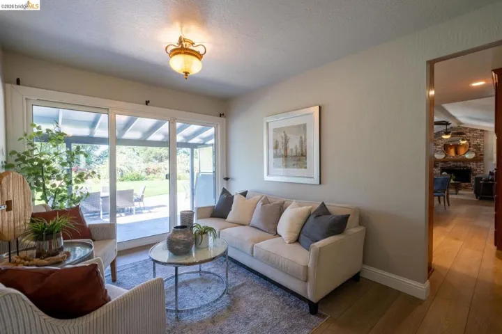 Spacious living area with sliding glass doors opening to an outdoor patio