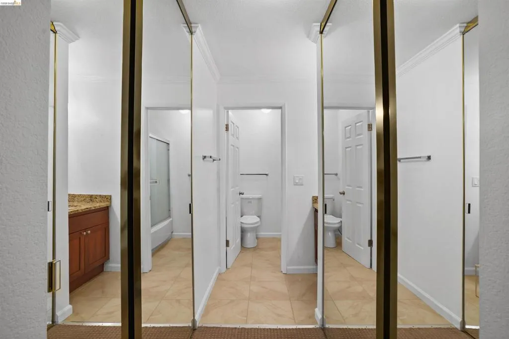 Mirrored closet doors providing visual expansion