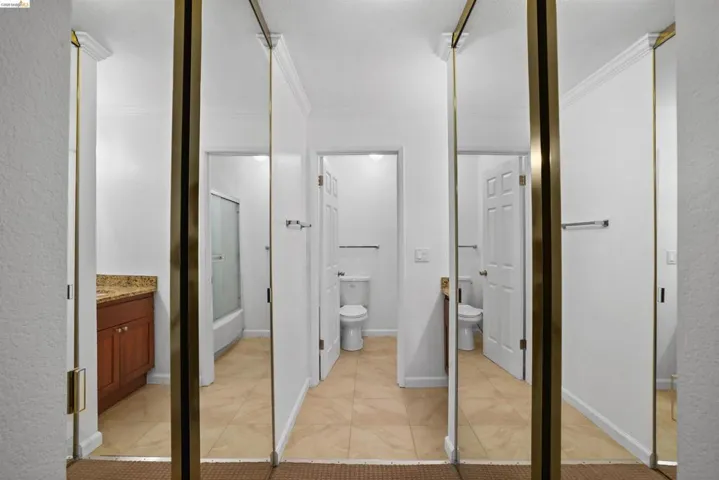 Mirrored closet doors providing visual expansion