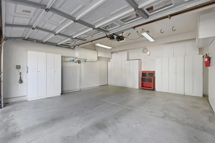 Large 2 Car Garage with plenty of storage area.