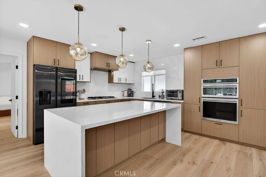 European-style cabinetry featuring a waterfall island.