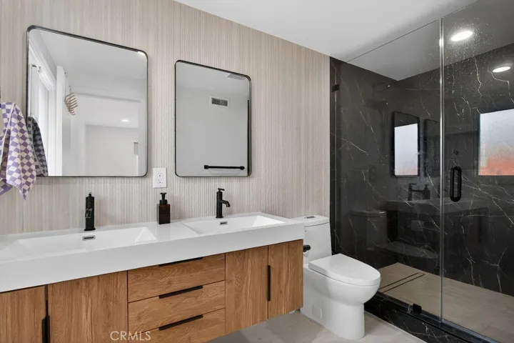 Primary bathroom featuring modern, high-end upgrades and contemporary finishes.