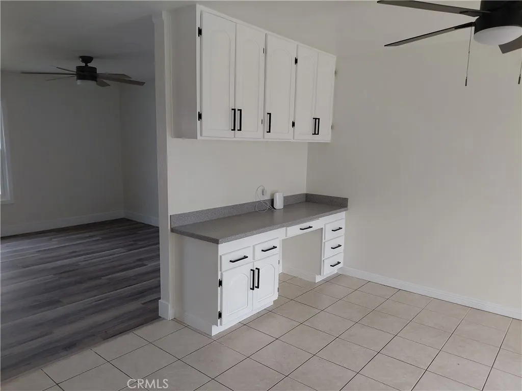 Built in desk and cabinets in country kitchen dining area