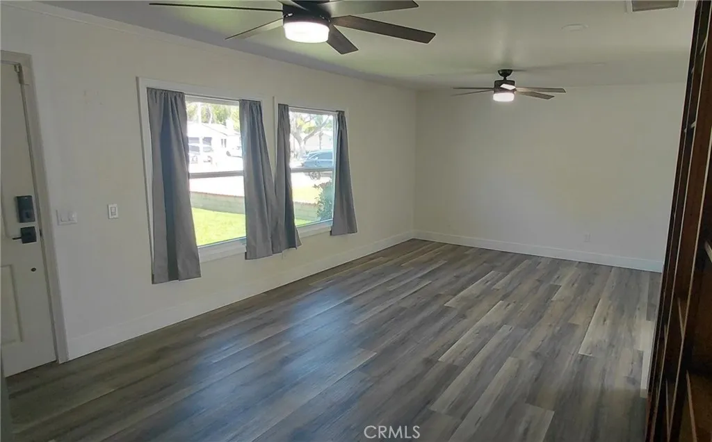 Living room from hallway curtains open