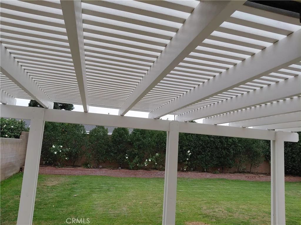 Backyard patio cover right outside country kitchen sliding glass door