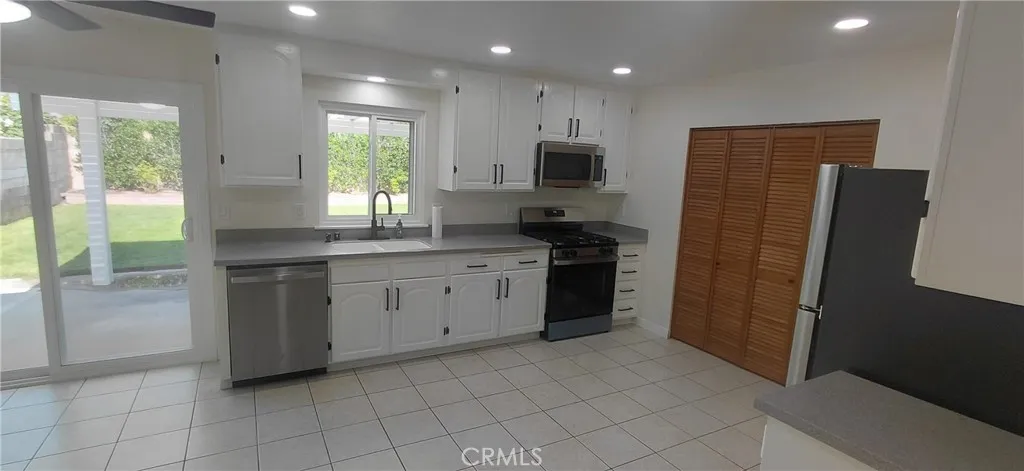 Looking into kitchen and dining area from living room doorway.