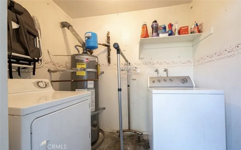 Individual laundry room with extra storage - there is a second storage closet in the front of the unit