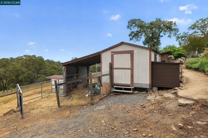 With new goat shelter.