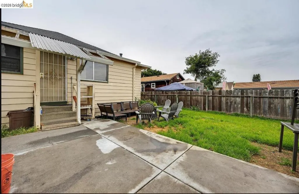 Expansive concrete patio area with direct access to the residence
