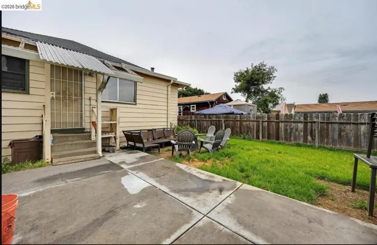 Expansive concrete patio area with direct access to the residence