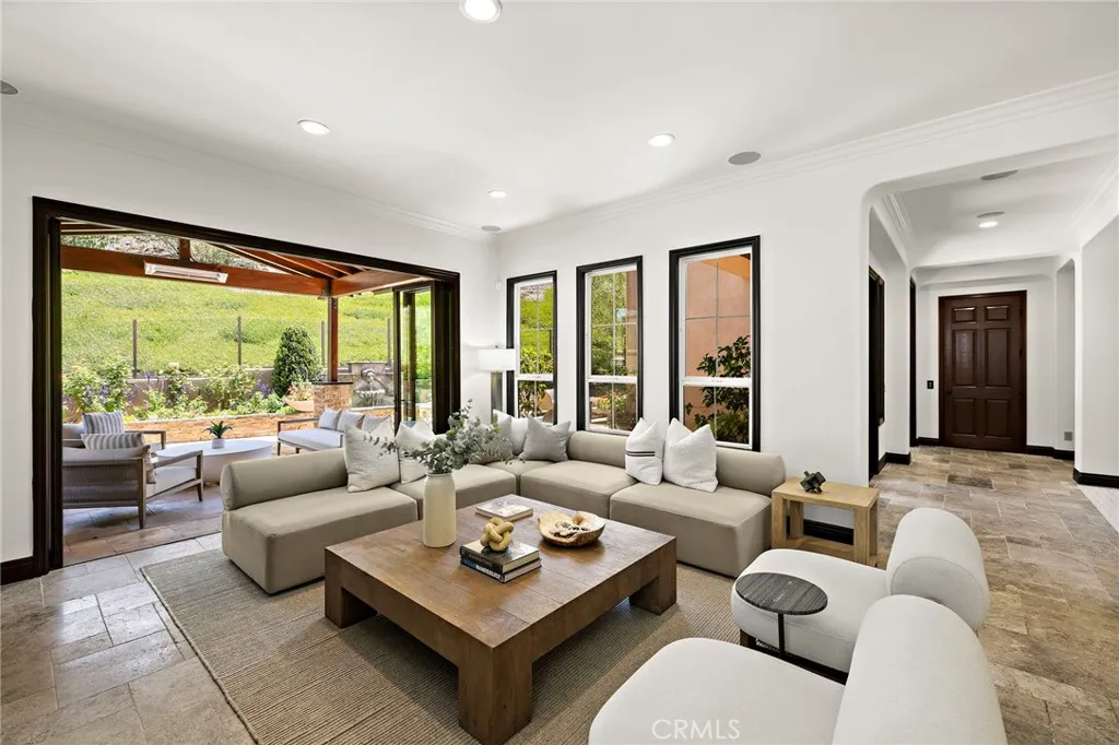 large great room that opens to the outside loggia