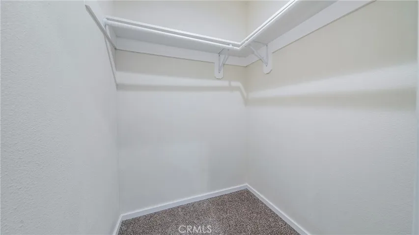 Main home walk-in closet in master's bedroom