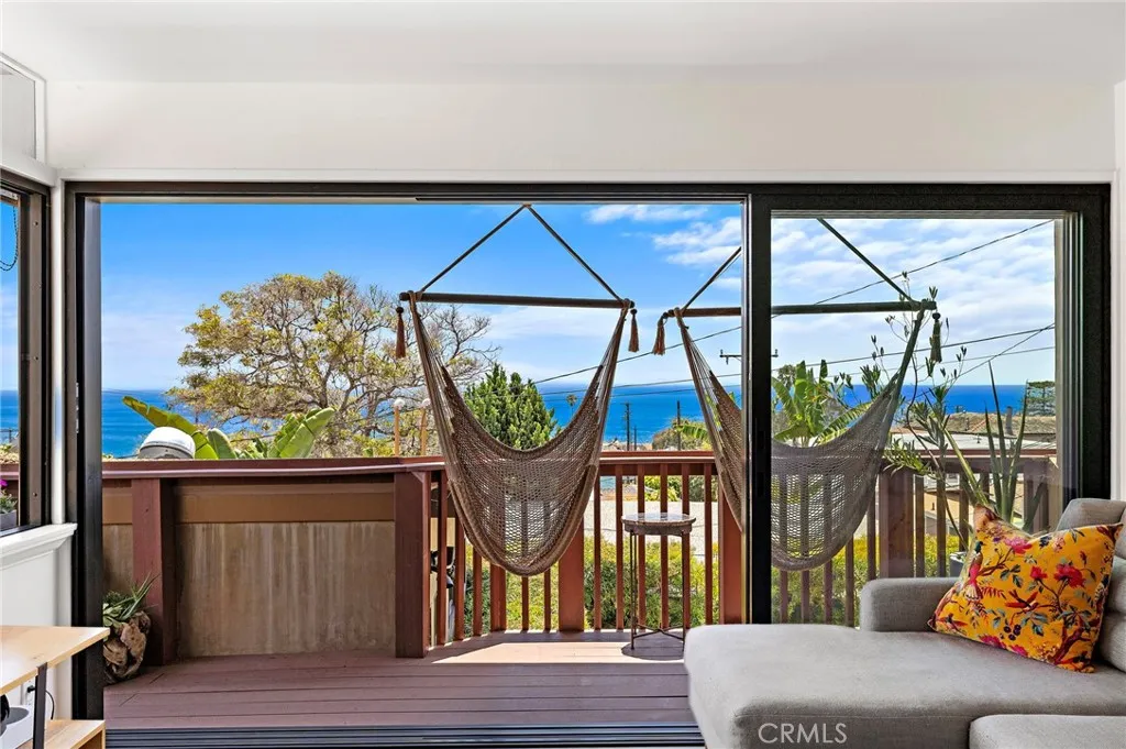 Kitchen and Living Room Open to Deck with Hammocks to Enjoy the Ocean view, breeze and sunsets.