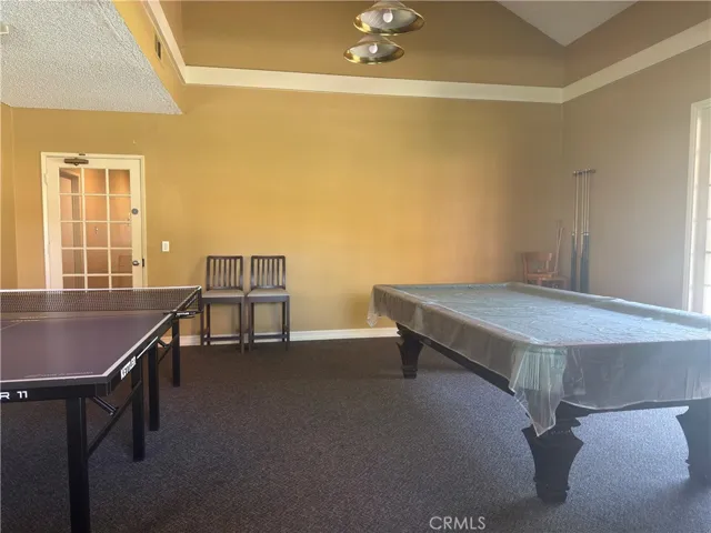 Great 1 bedroom, 1 bath, 754 sq foot down unit 2 miles from the beach, gated community, 1 carport, large rooms and a fantastic quiet relaxing outdoor space 3 times the normal size of balconies, with some utilities included and nice pool, spa, and clubhouse.