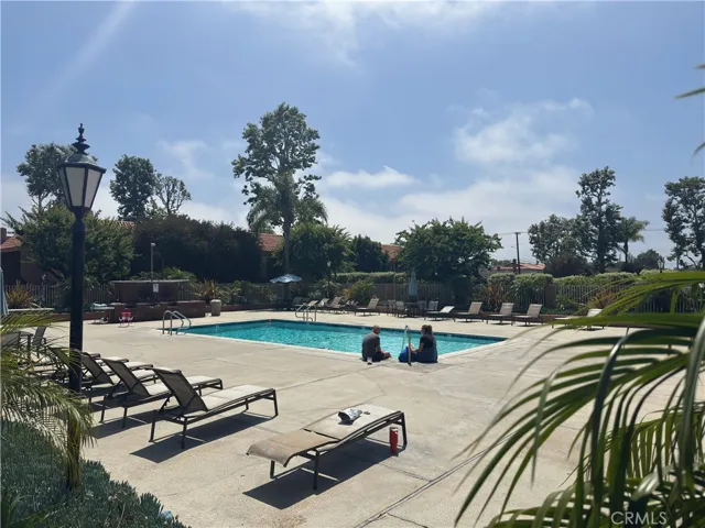 Great 1 bedroom, 1 bath, 754 sq foot down unit 2 miles from the beach, gated community, 1 carport, large rooms and a fantastic quiet relaxing outdoor space 3 times the normal size of balconies, with some utilities included and nice pool, spa, and clubhouse.