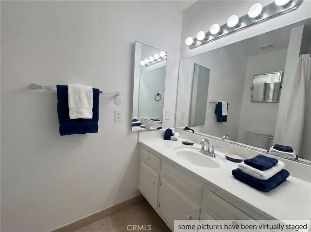 Great 1 bedroom, 1 bath, 754 sq foot down unit 2 miles from the beach, gated community, 1 carport, large rooms and a fantastic quiet relaxing outdoor space 3 times the normal size of balconies, with some utilities included and nice pool, spa, and clubhouse.