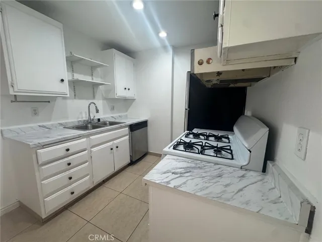Great 1 bedroom, 1 bath, 754 sq foot down unit 2 miles from the beach, gated community, 1 carport, large rooms and a fantastic quiet relaxing outdoor space 3 times the normal size of balconies, with some utilities included and nice pool, spa, and clubhouse.