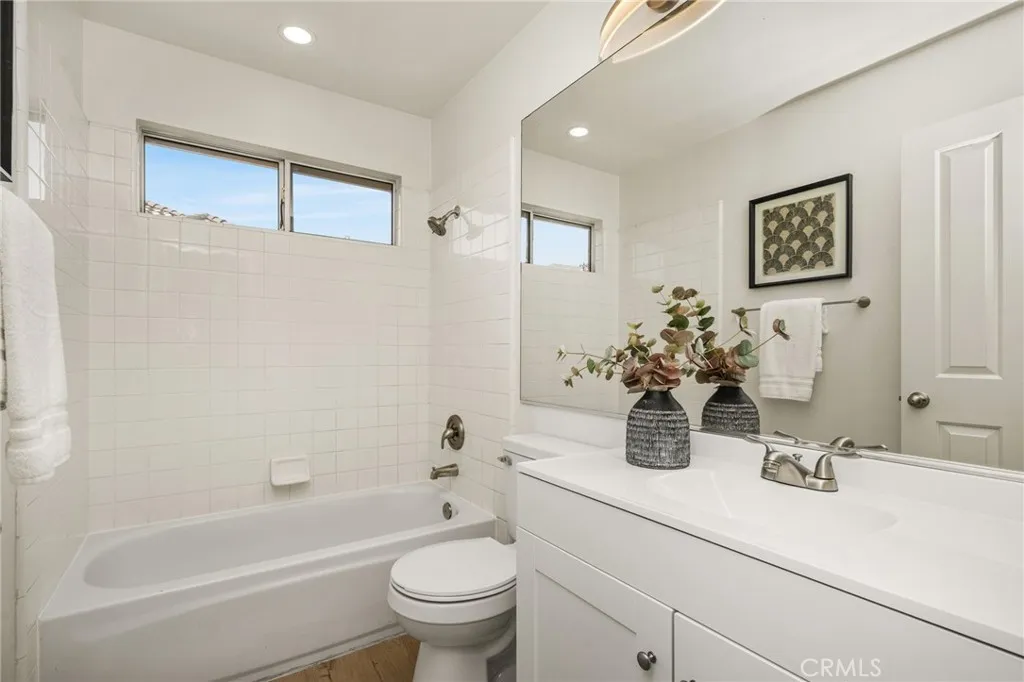 Hall bath with white shaker cabinet